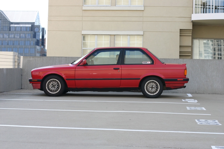 BMW E30 318iS on parking garage roof.